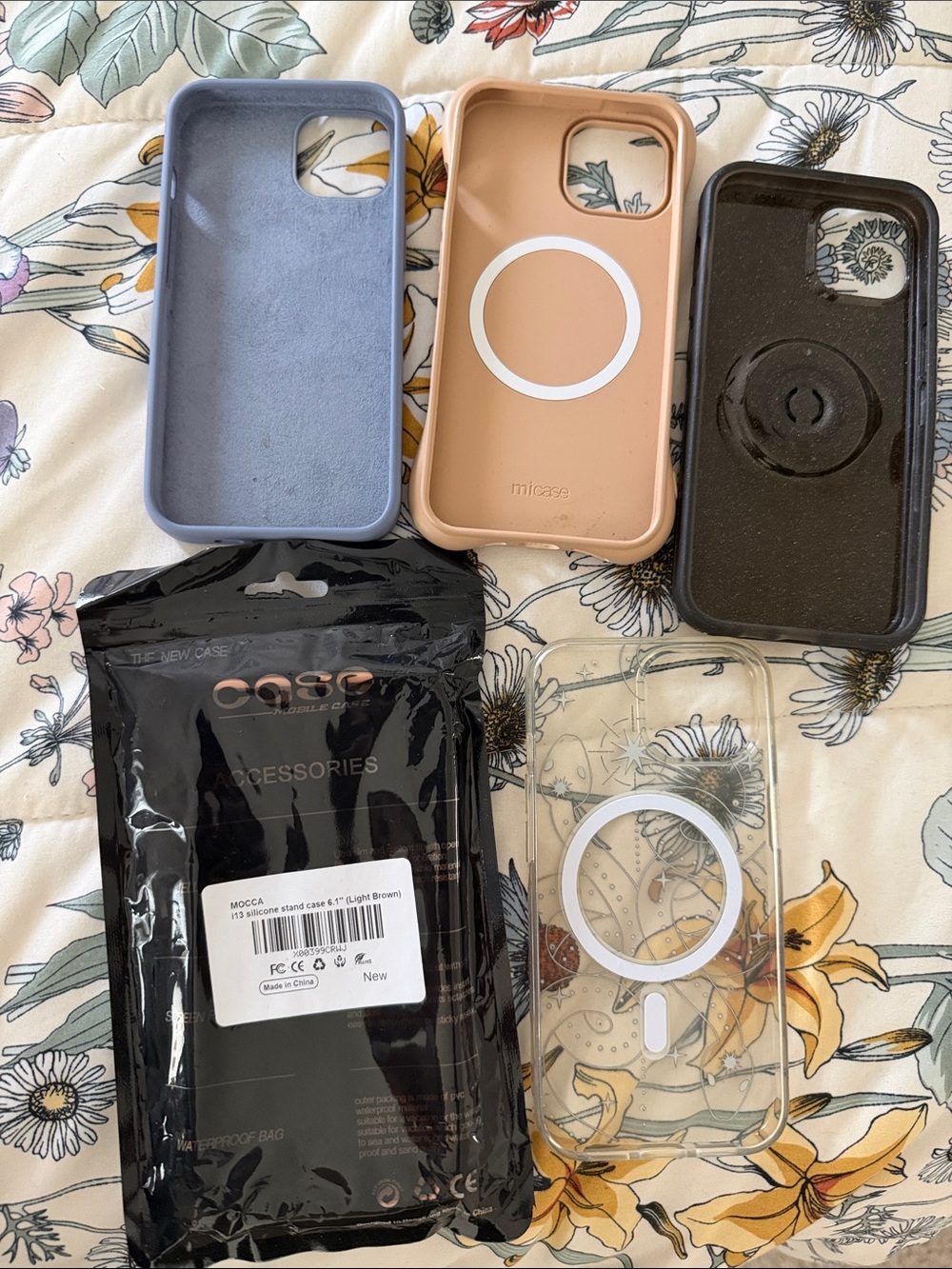 IPhone 13 Cases in Blue, Beige, Pink, Clear, and Black with Gold Stars - Picture 2 of 2